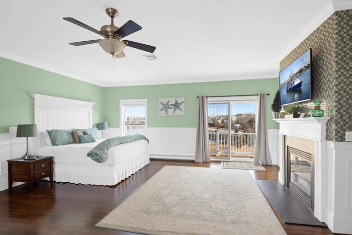 guest room with bed, fireplace, table and chairs