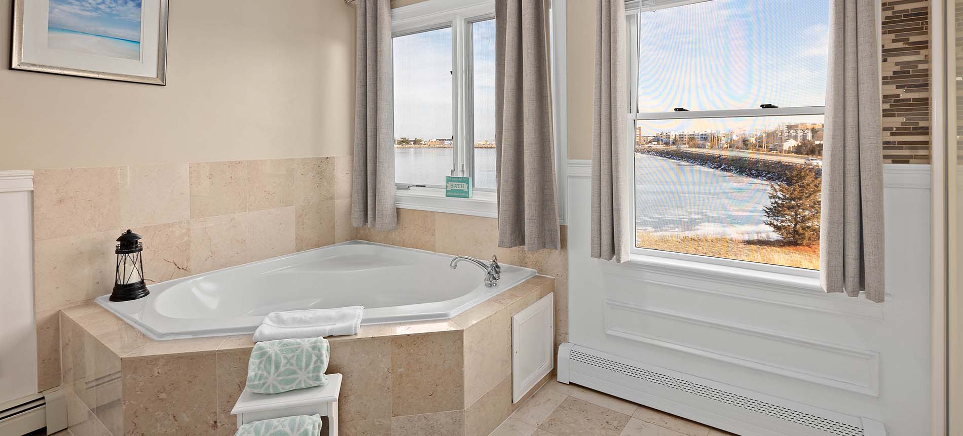 hull ma waterfront hotel bathroom with spa tub